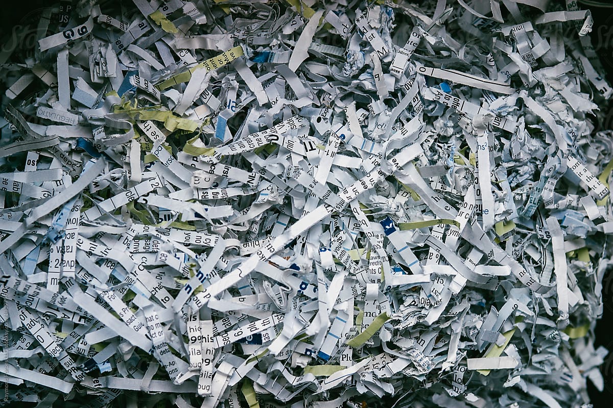 Shredded Paper document in shredder at business office