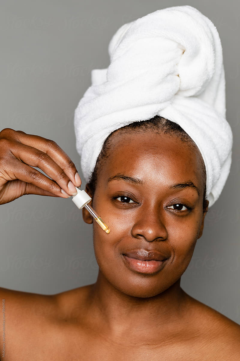 Black Woman Applying Her Skincare Routine