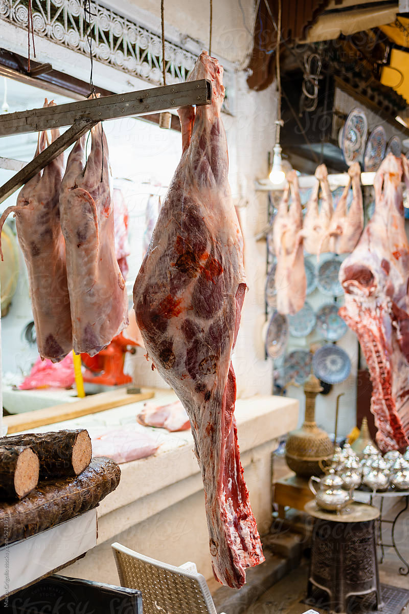 Meat hanging outside a butcher\'s shop