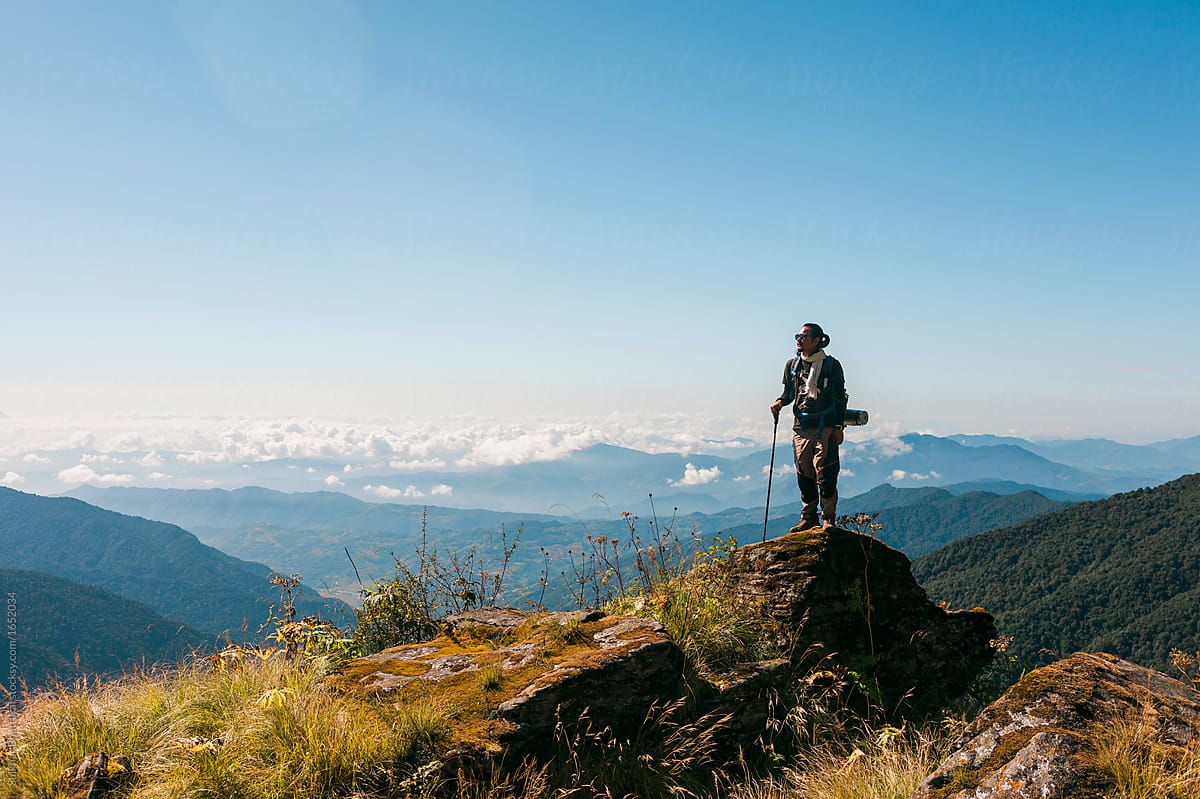 Mardi Himal Trek: A man taking a break and enjoying the view.