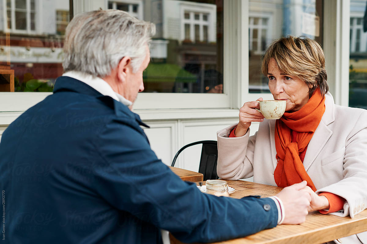 Mature couple having coffee together