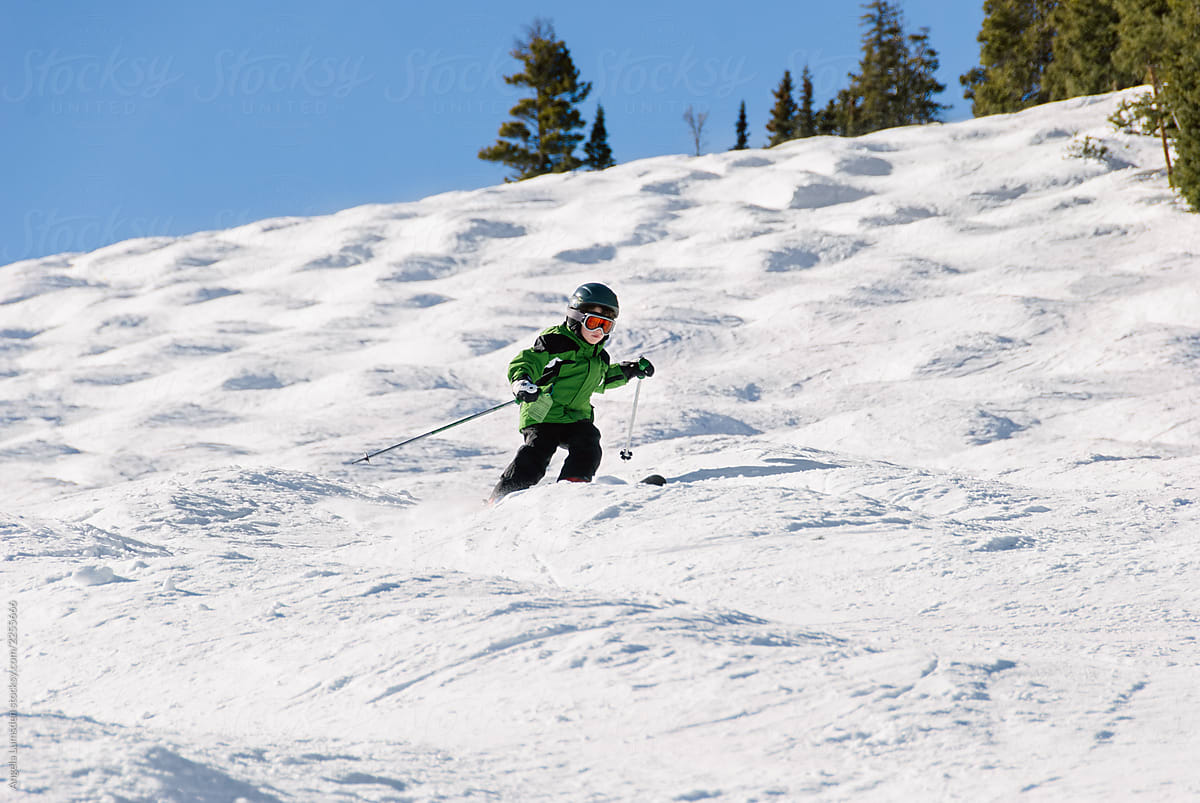Child skiing moguls
