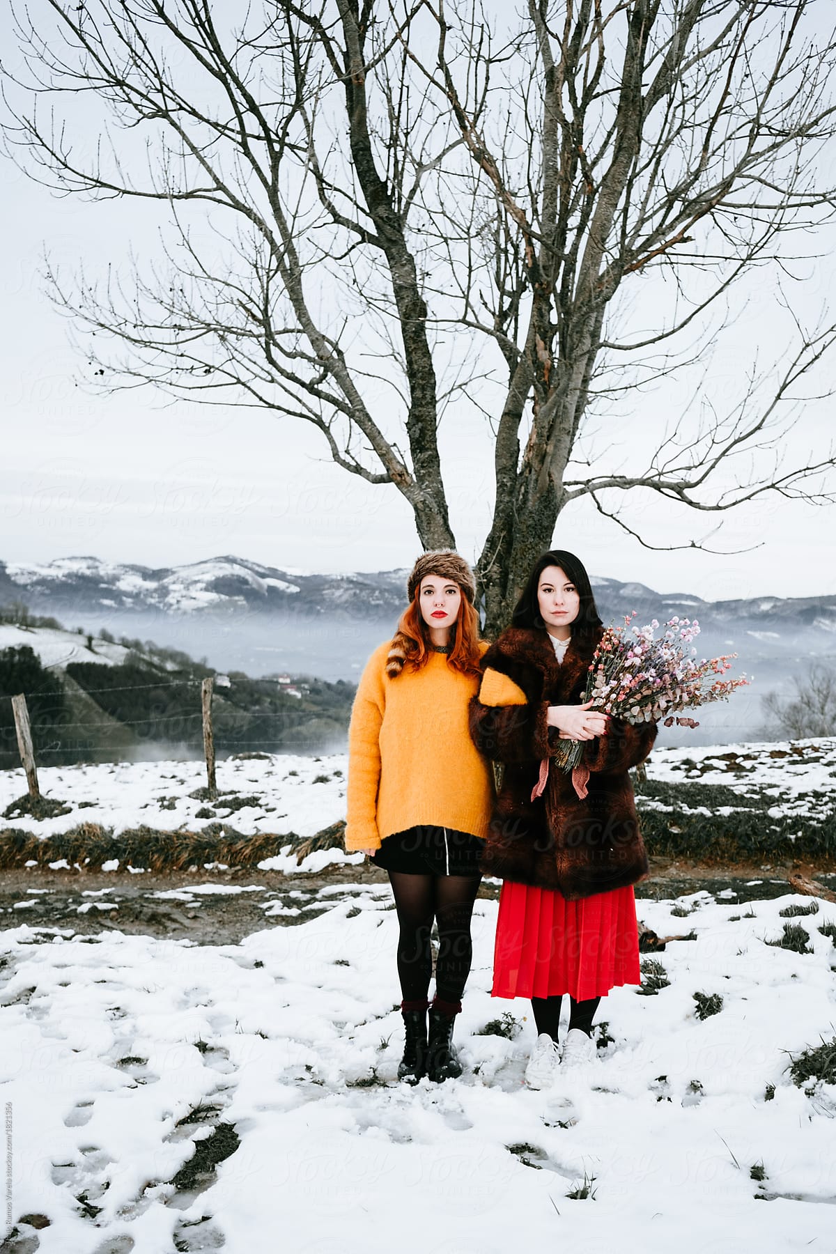 couple of cool woman with strange clothing in a winter landscape