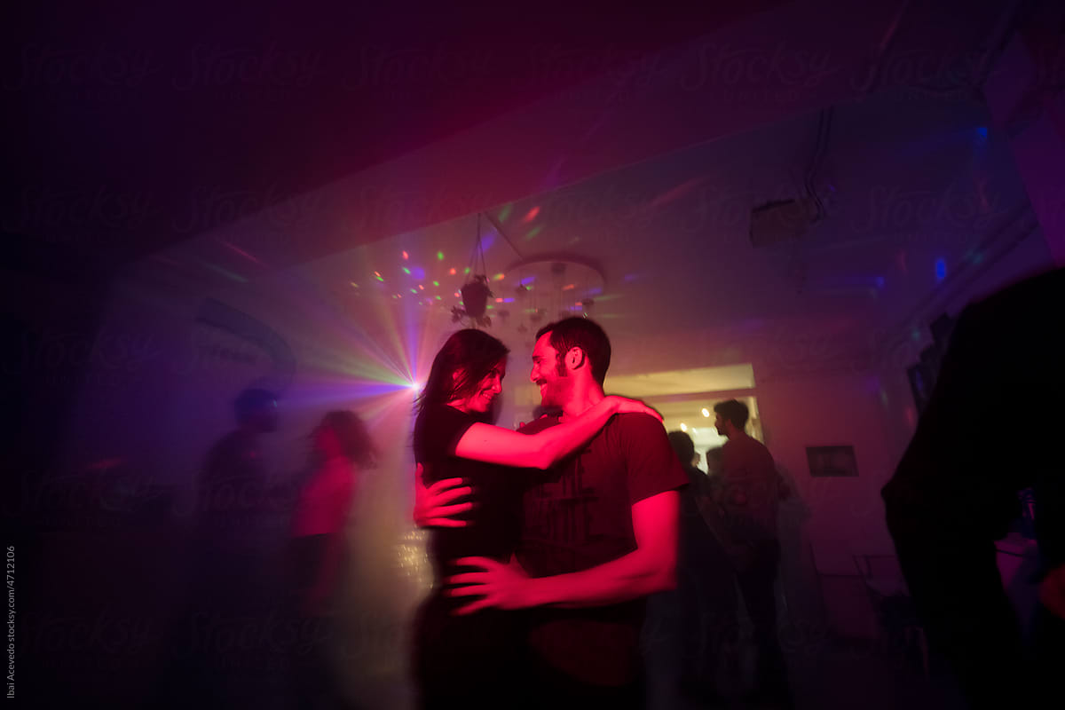 Smiling lover dancing together at the party