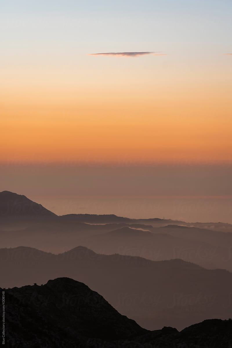 views of a mountain range at sunrise