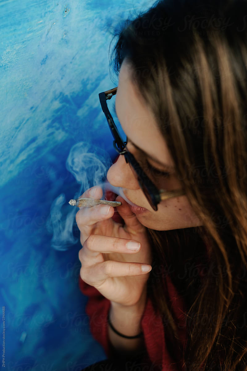 Young woman smoking weed