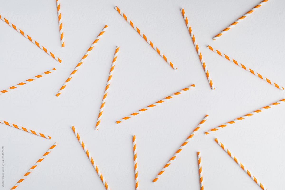 Colorful paper straws on white background