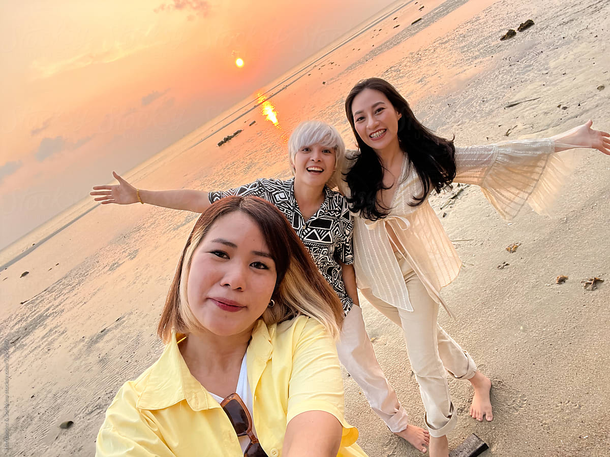 Selfie Of Three Happy Friends On The Beach