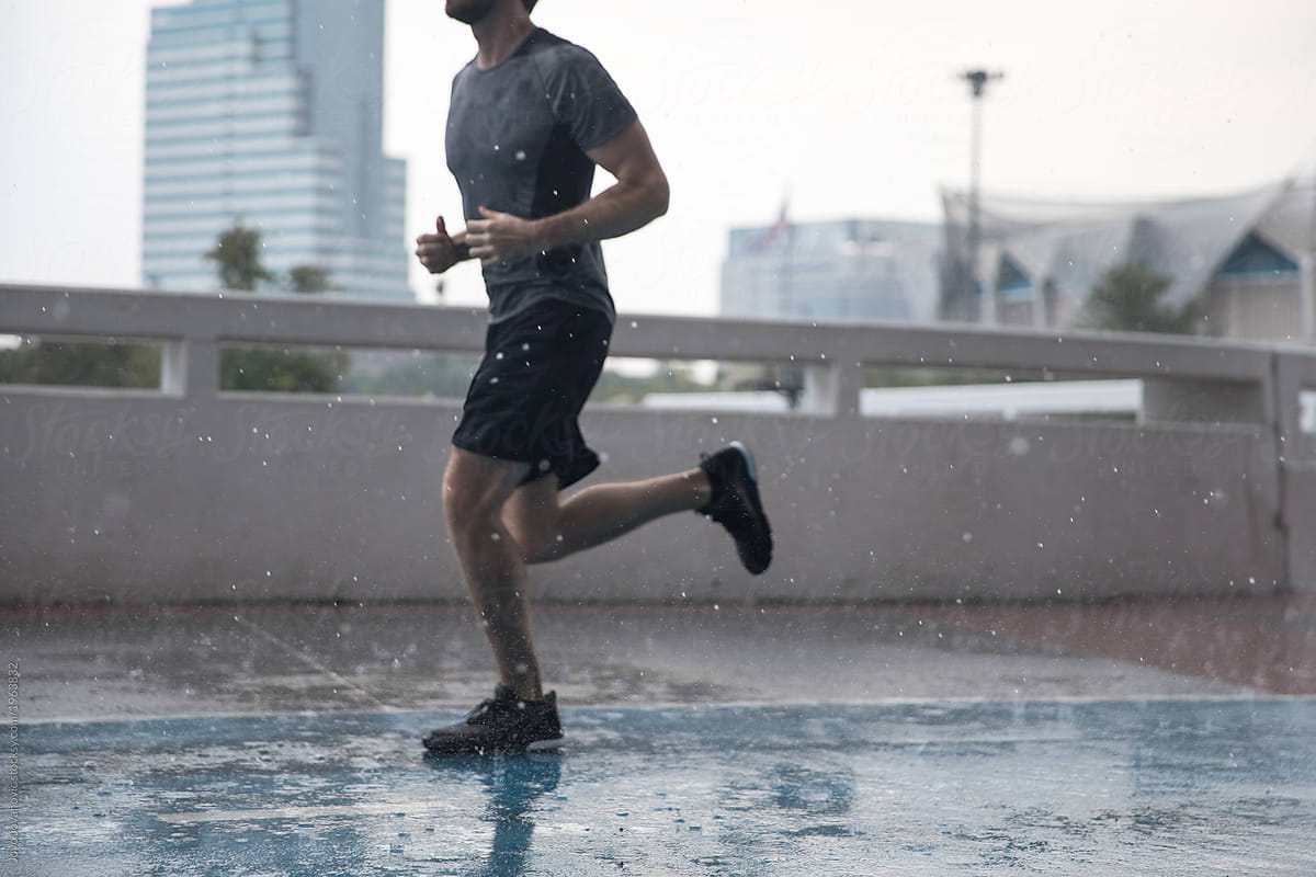 Faceless Man Running in the Rain