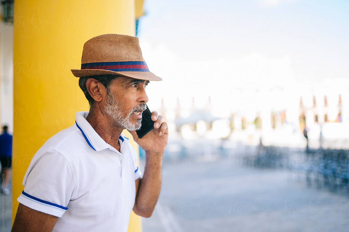 Cuban man talking on smartphone