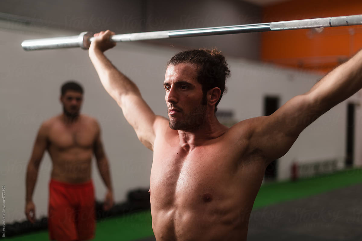 Focused athlete about to lifting a barbell