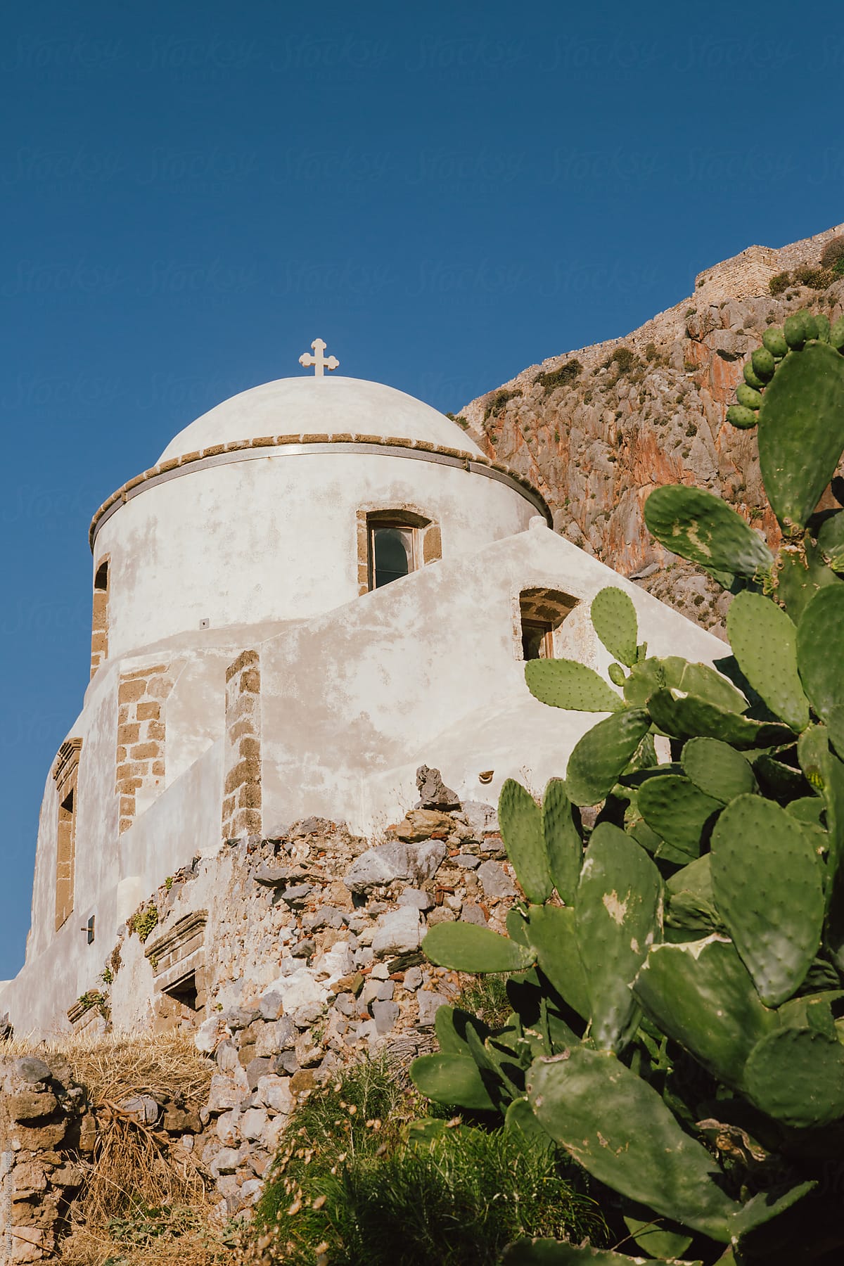 Greek old church with cross.