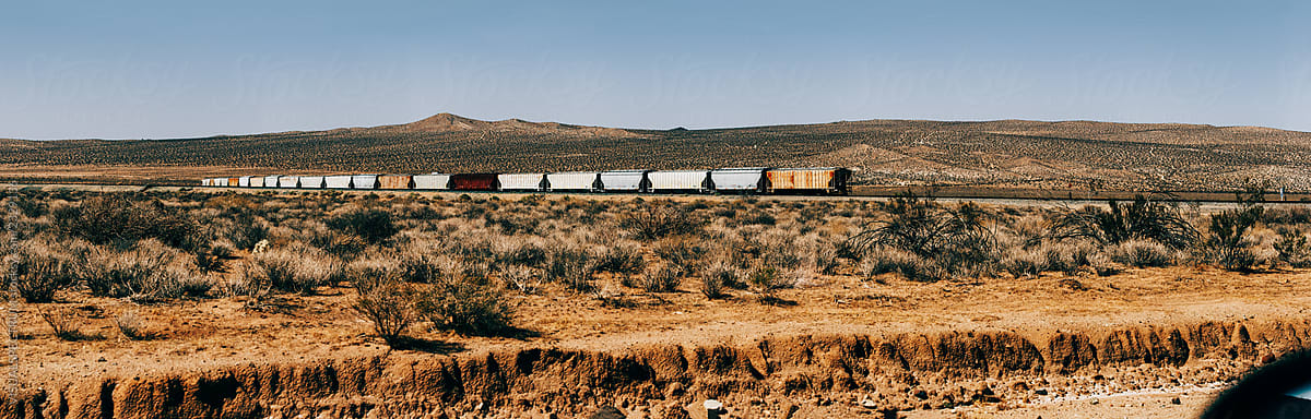 Cargo Train in Remote California Desert Landscape