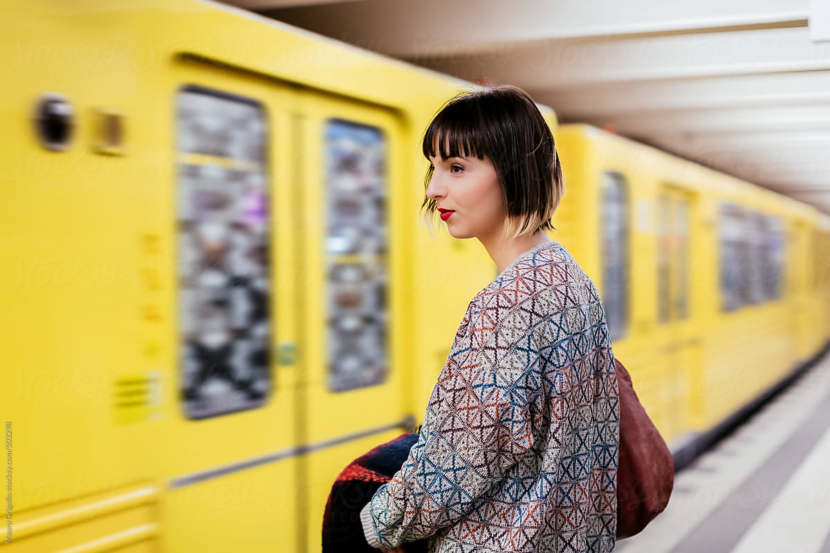 Woman waits for the train to go home