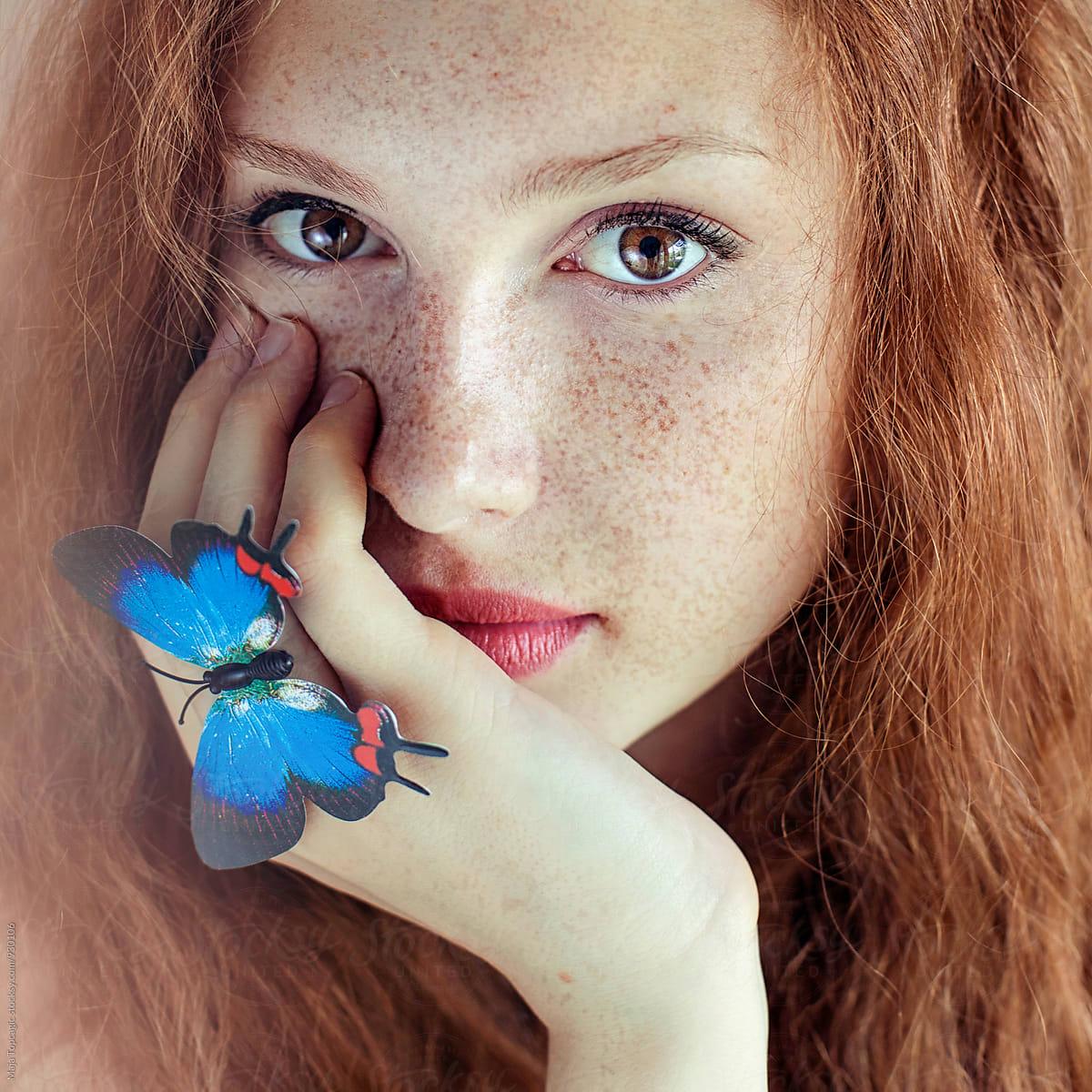 Portrait of a beautiful redhead with freckles