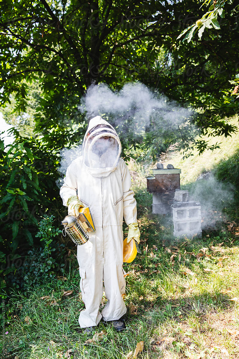 Beekeeper with bee smoker in hand