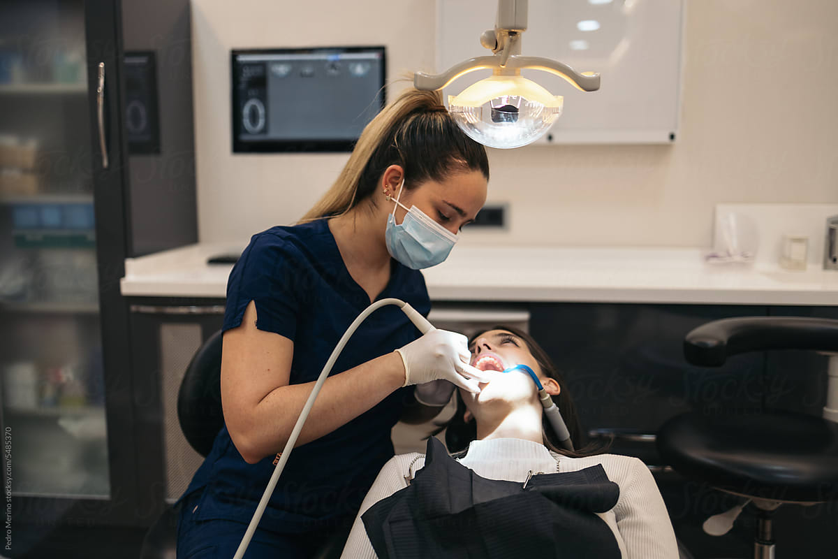 Dentist During A Dental Intervention With A Patient