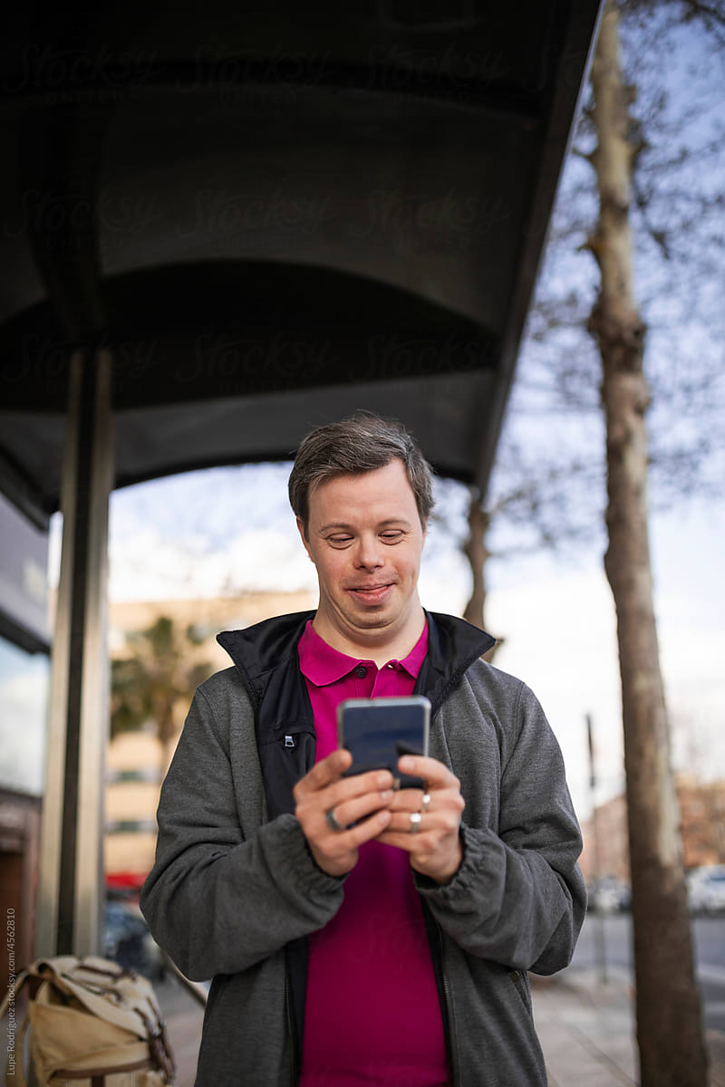 Man with down syndrome with mobile phone