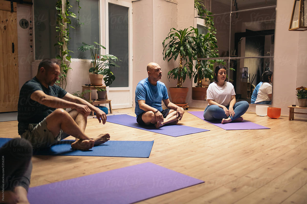 Group of people receiving a yoga class