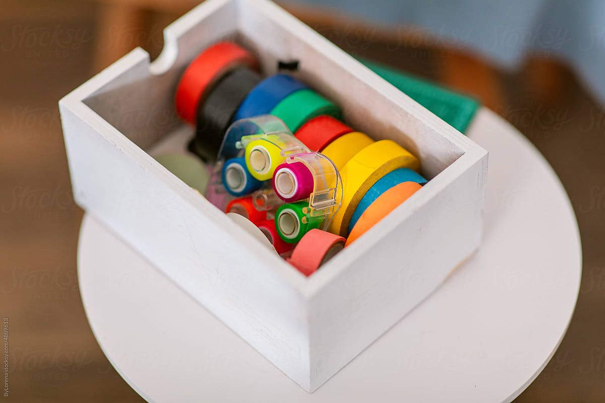 Colorful washi tapes organized on box closeup