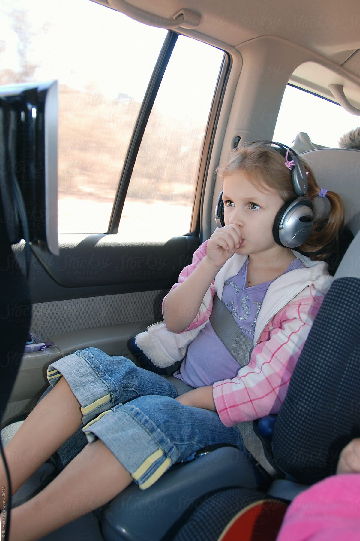 little girl in car