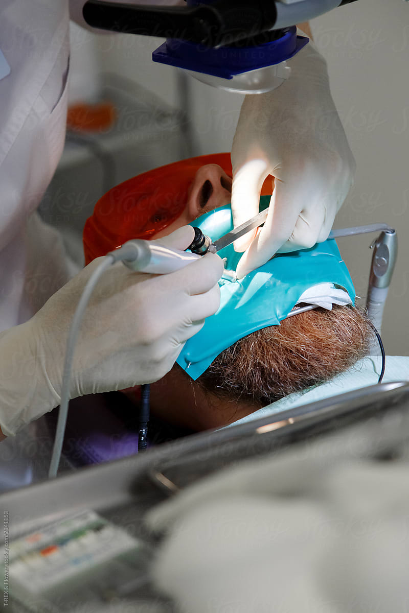 Crop dentist providing operation for man