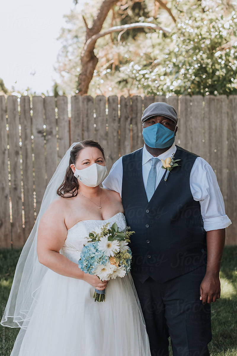 Bride and Groom Wearing Face Masks at Wedding during COVID-19