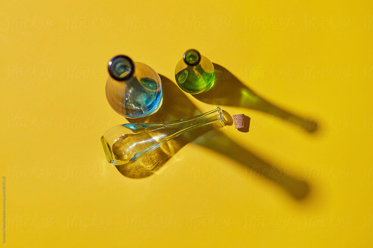 Top view of three glass bottles with cork without water empty wi