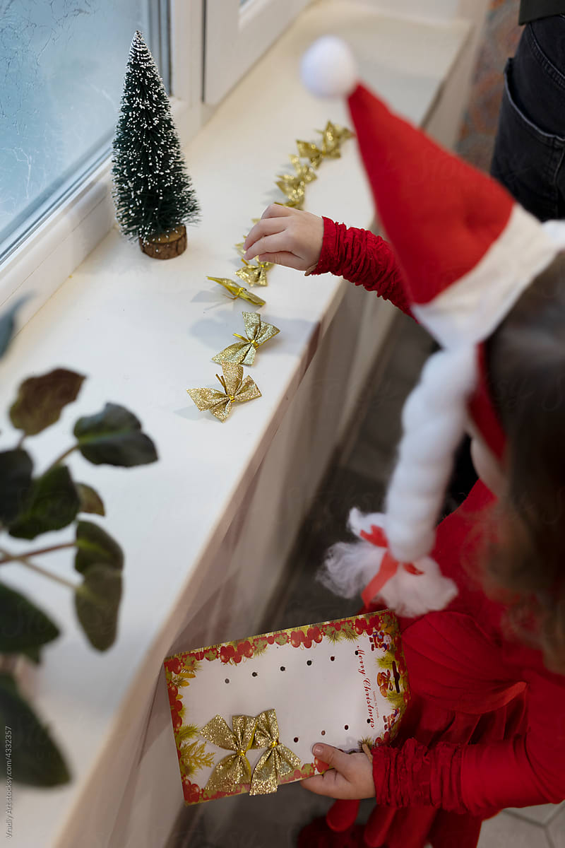 Little girl with Christmas decorations