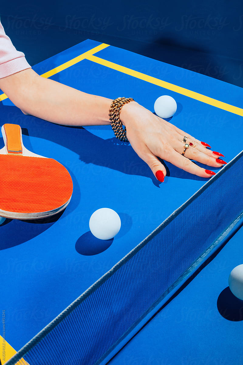 female hand and ping pong.