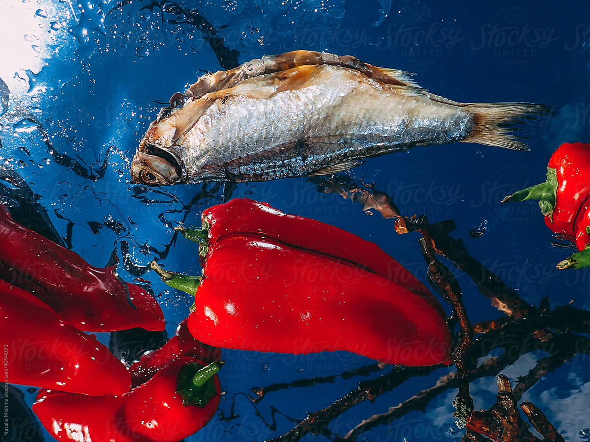 Still life, dry fish with red pepper.