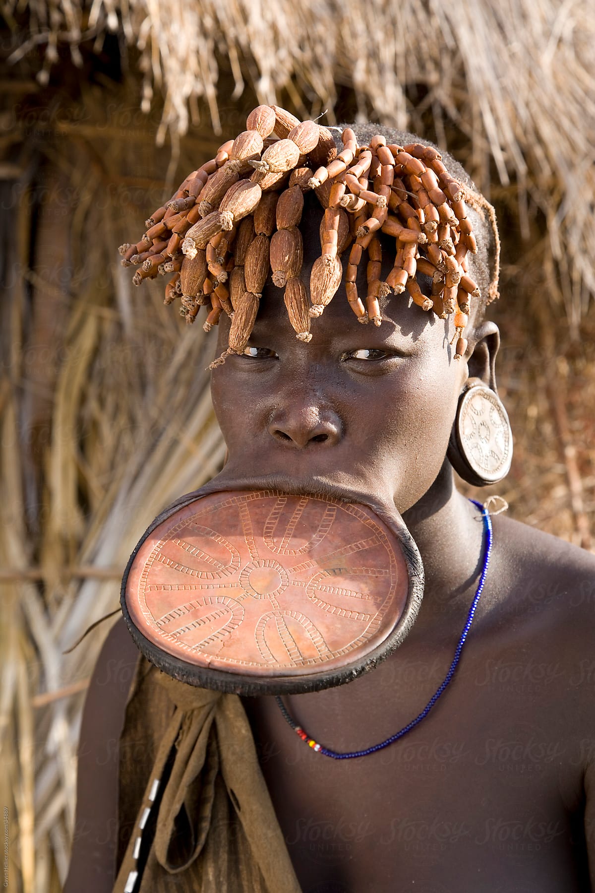 Mursi woman with clay lip plate, Mursi Hills, Mago National Park, Lower Omo Valley, Ethiopia, Africa.
