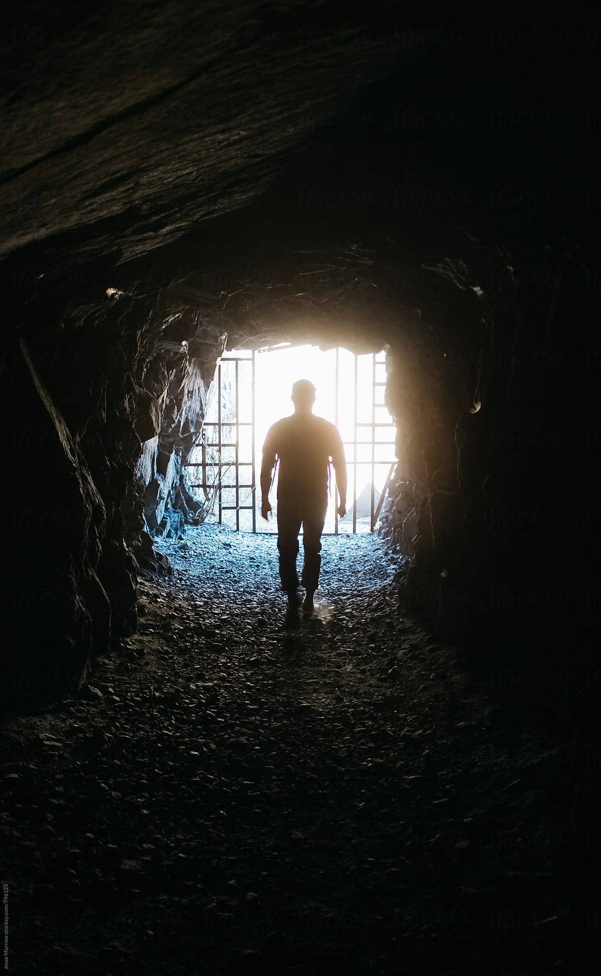 Silhouette Of Man At The End Of The Tunnel Walking Into Light | Stocksy ... Silhouette Man Walking Tunnel