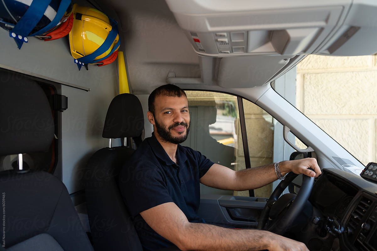 Smiling truck driver in cab