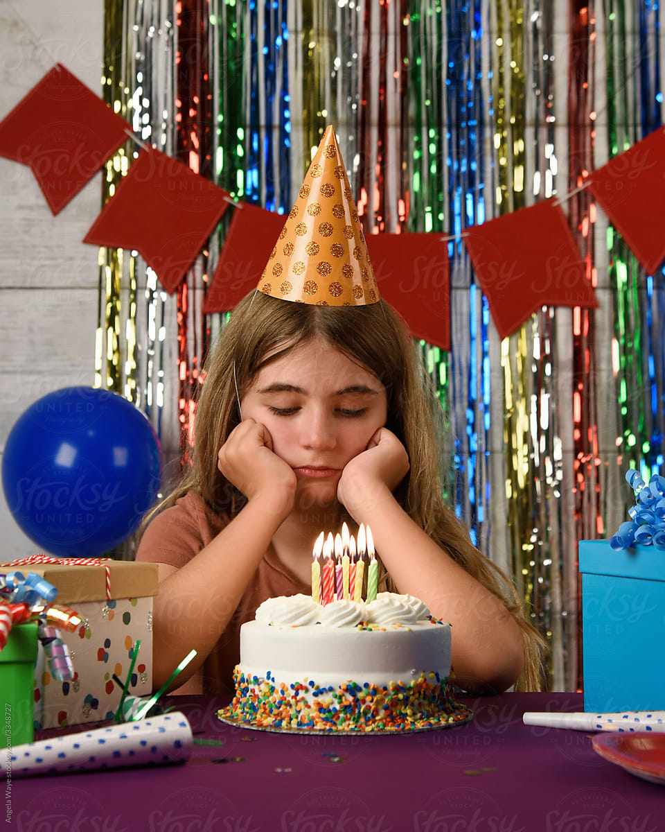 Sad Birthday Girl Looking at Party Cake