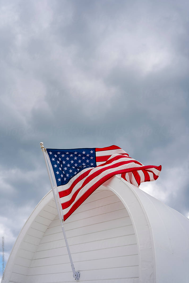 American Flag on cloudy sky