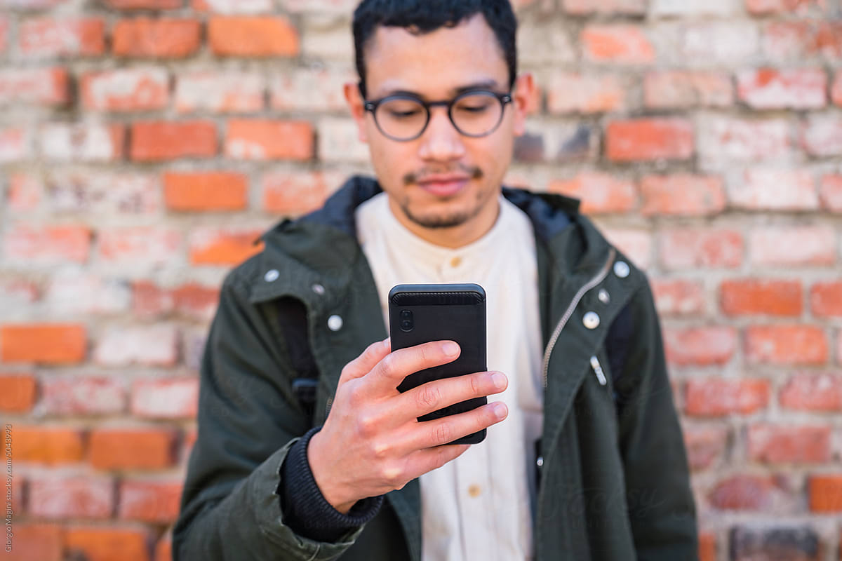 Urban Young Man Holding a Mobile Phone