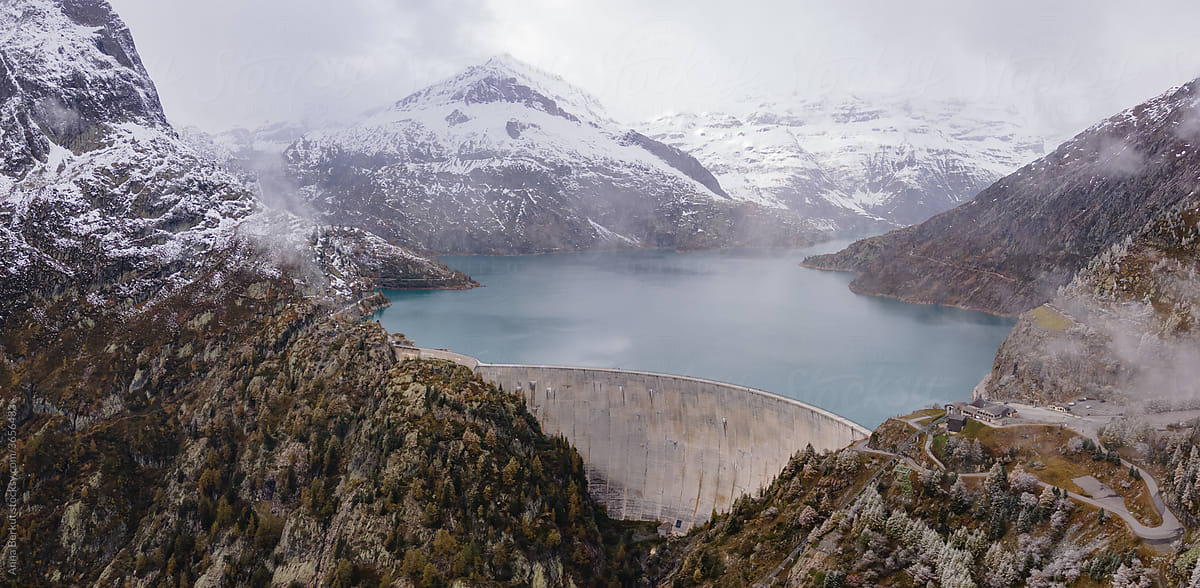 panorama of water dam in Alps mountains, aerial view