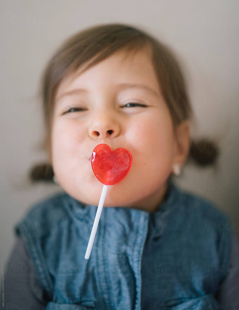 Girl with heart lollipop lips