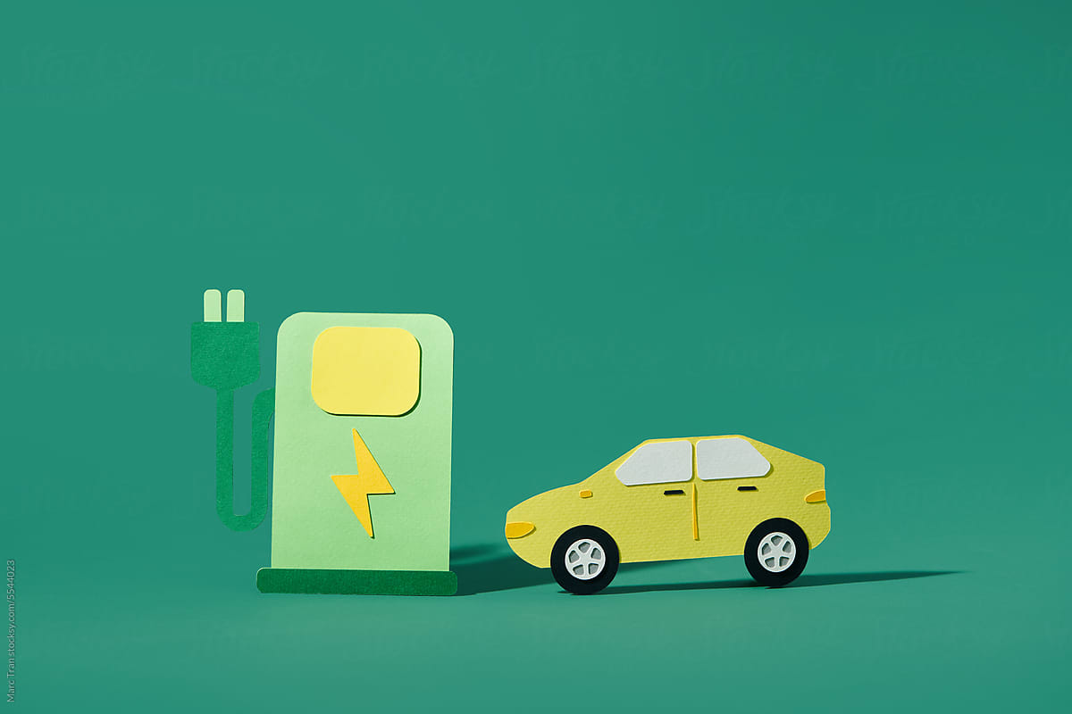 Electric car. Paper cut car with electric plug on color background