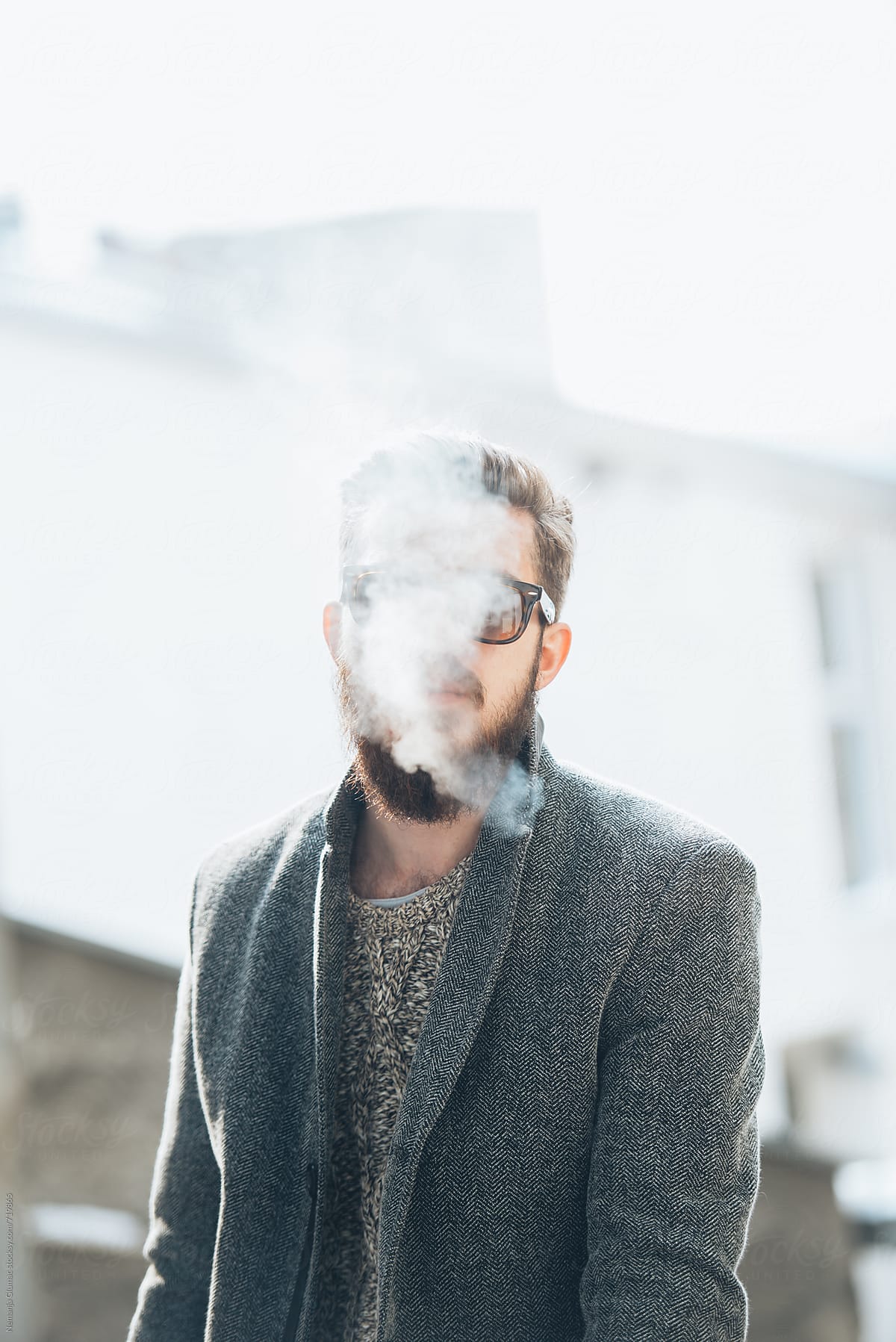 Man With Beard Smoking Outdoors