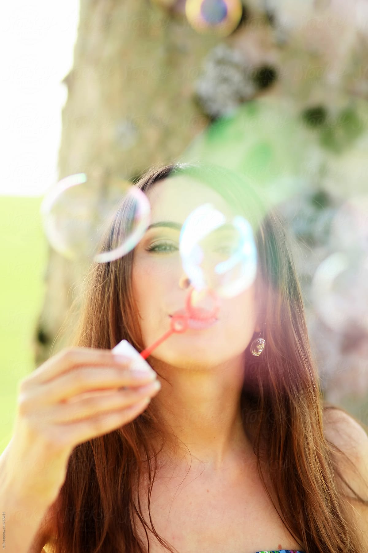 Girl Blowing Bubbles Outdoors By Rolfo Bubble Soap