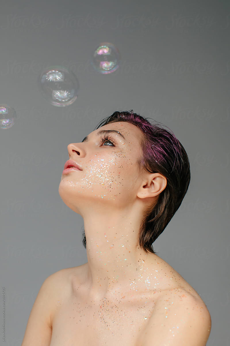 Pretty woman with soap bubbles