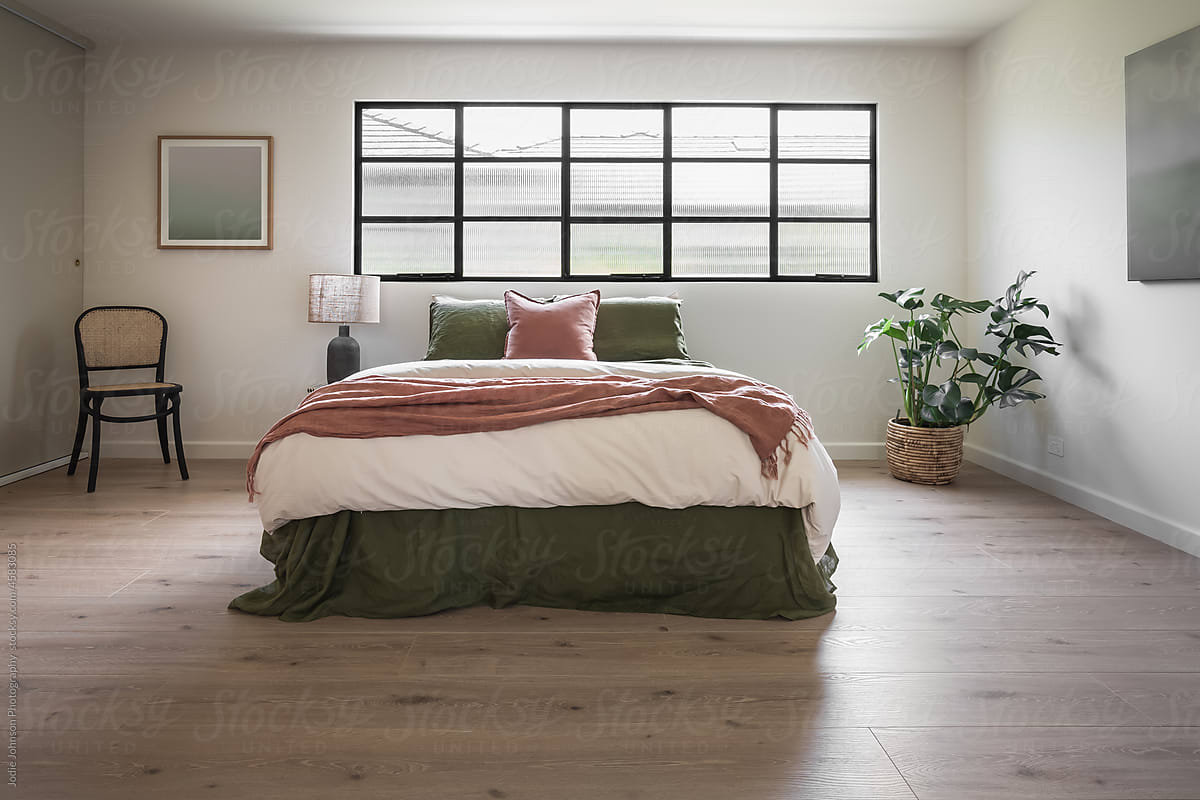 Large modern bedroom with indutrial steel windows