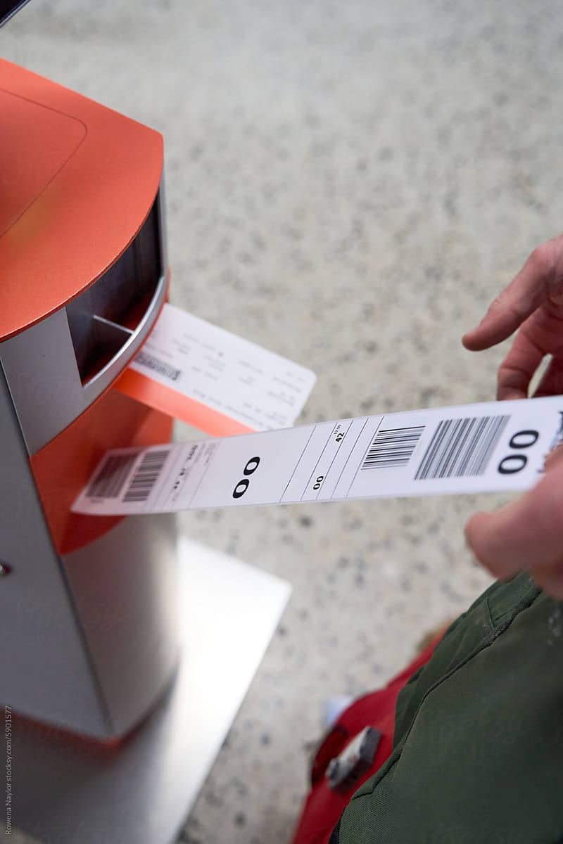 Baggage ticket being printed at airport self check-in machine