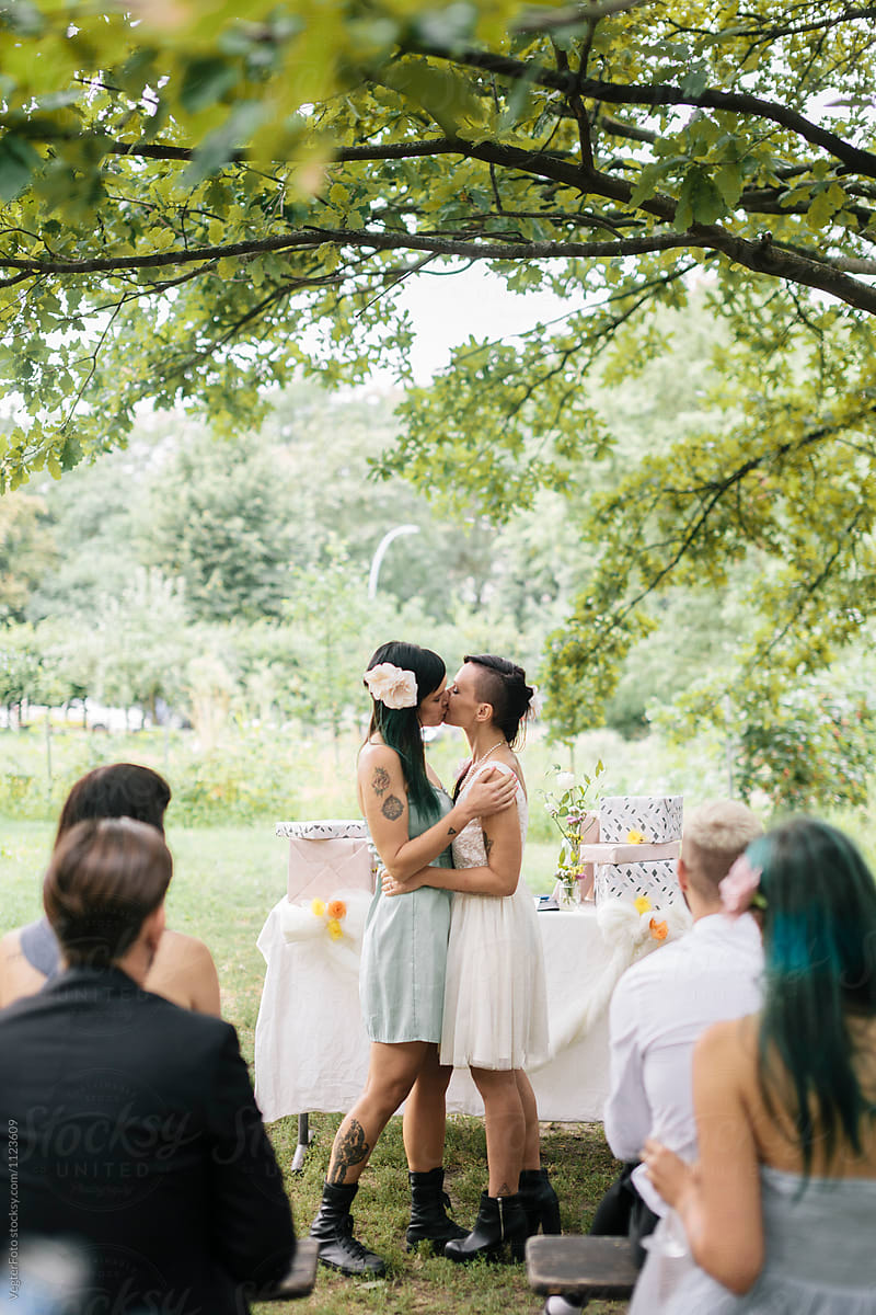 Lesbian kissing at Wedding by VegterFoto - Stocksy United