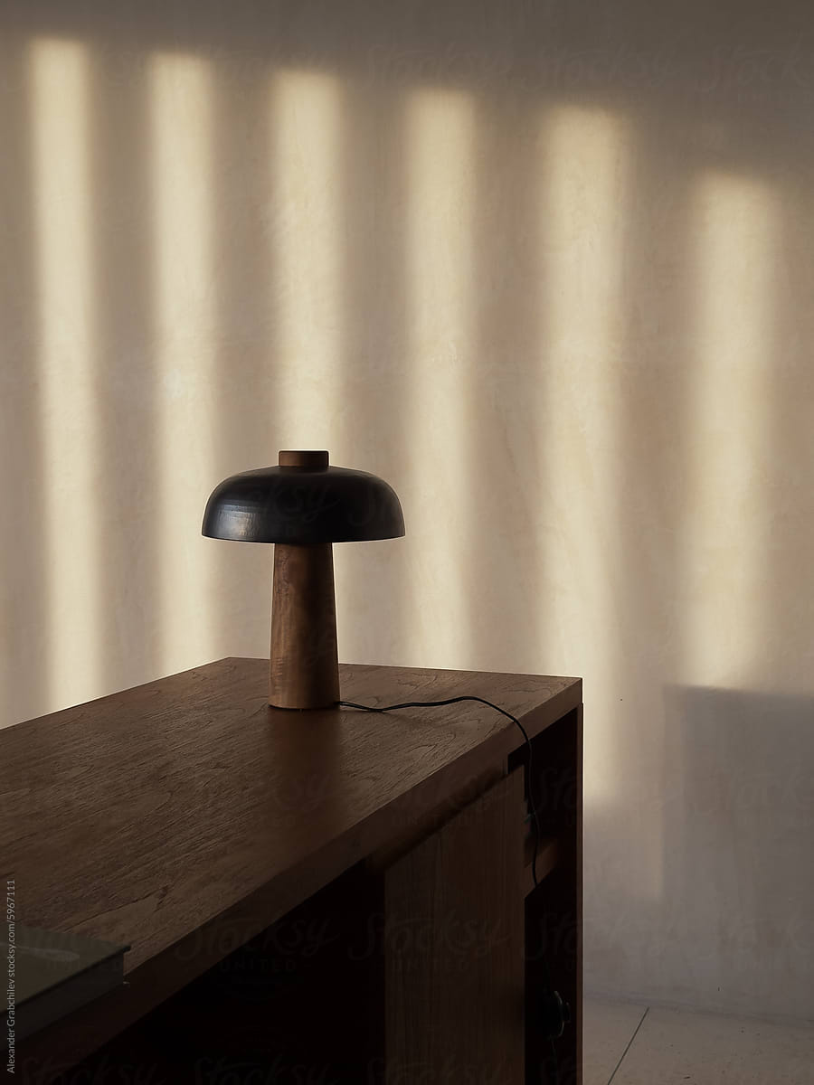 Minimalist Desk with Lamp and Shadow Play