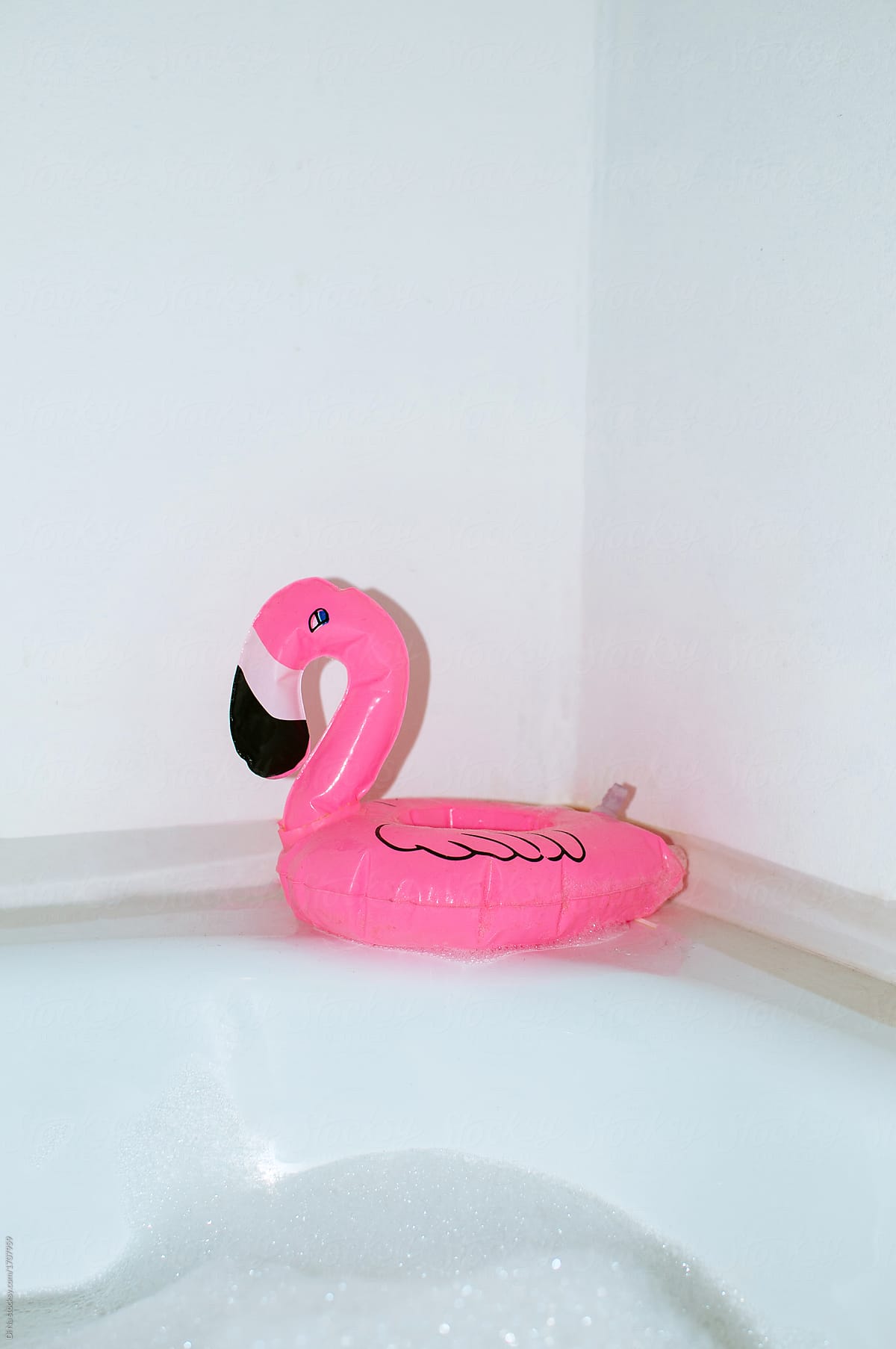 Pink flamingo toy in bathroom