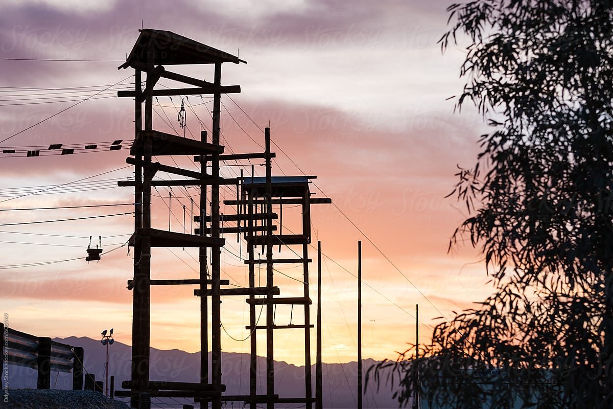 Rope Course Towers Silhouette at Sunset