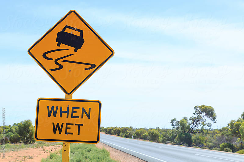 Slippery when wet warning sign on the Nullarbor Plain. Western Australia.